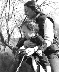 Barb with her daughter in 1980 -- her first ride.